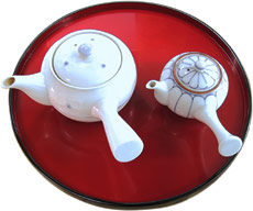 two tea pots and a tray